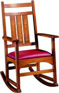Stickley Harvey Ellis Wooden rocking chair with a red cushion.