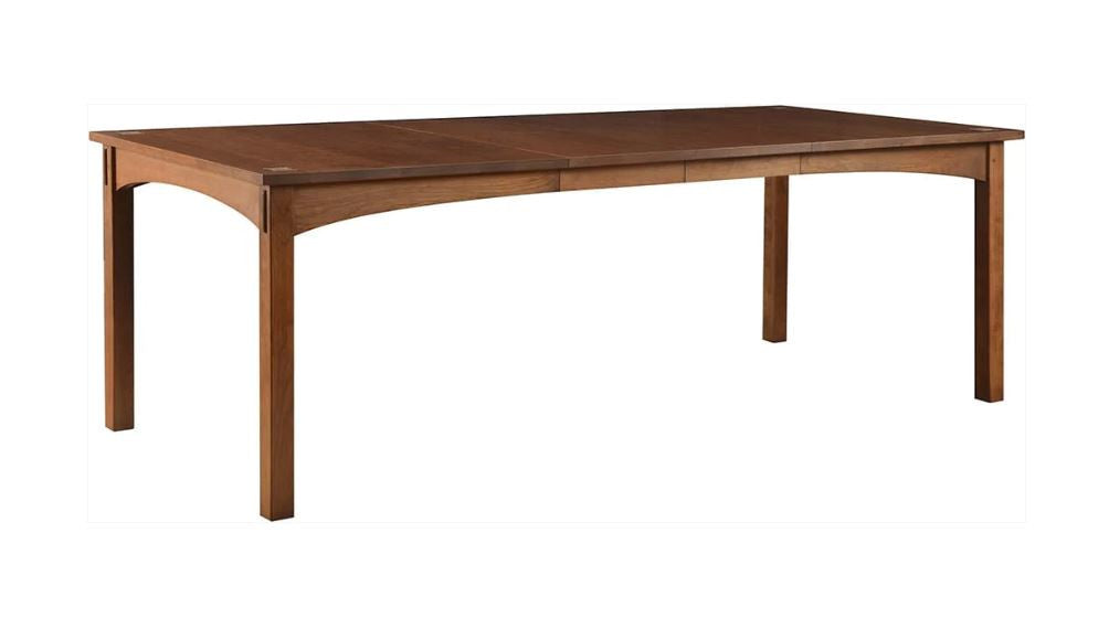 Harvey Ellis wooden dining table on a white background with the extenders.