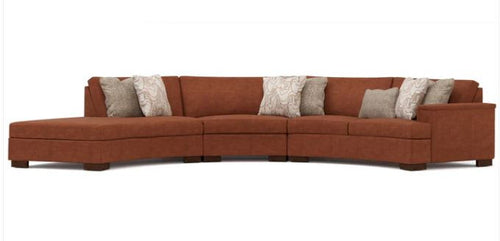 Brown sectional sofa with patterned cushions on a white background