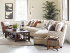Living room with beige sectional sofa, wooden coffee table, and armchair. Stickley Highlands Cocktail table with a shelf. In cherry wood or oak. 