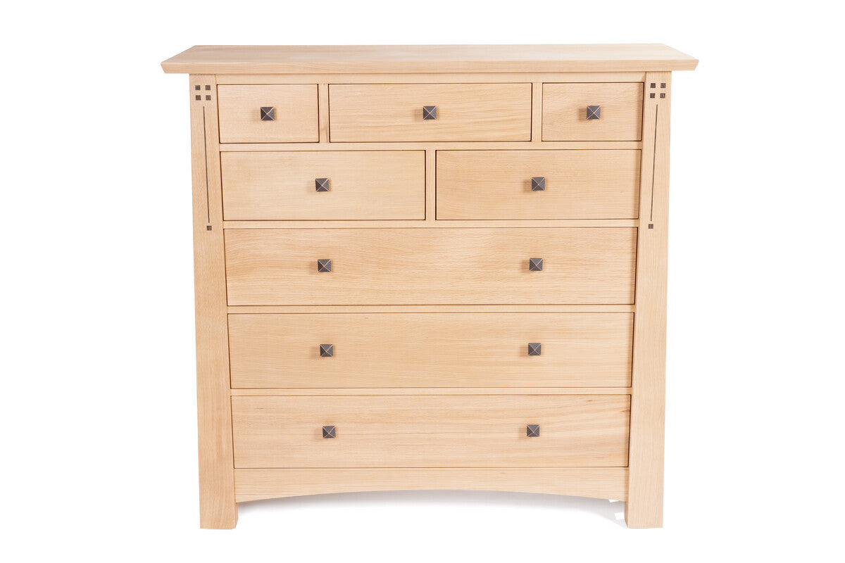 Wooden dresser with multiple drawers on a white background
