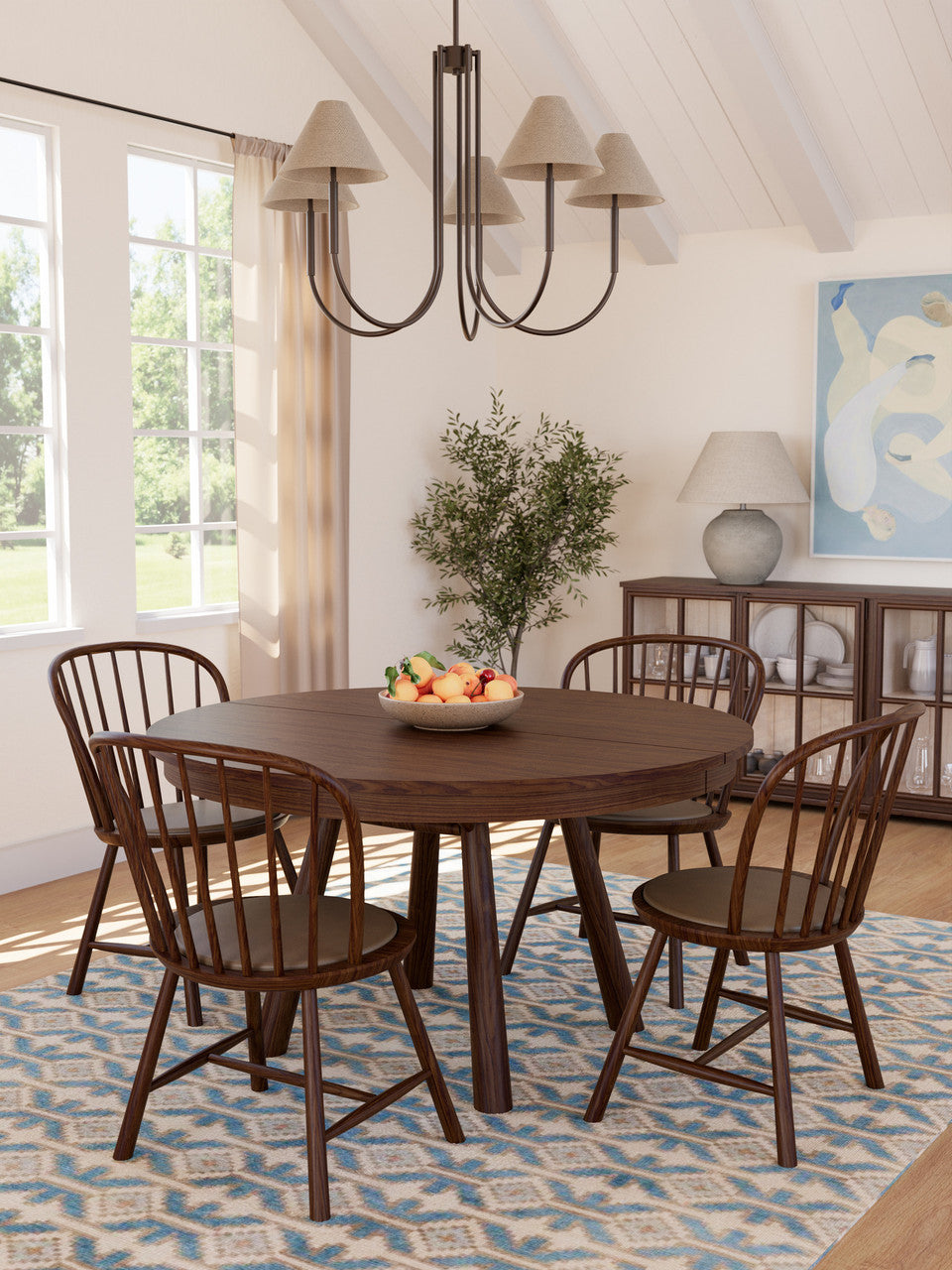 Dining room with wooden table and chairs, chandelier, and decorative elements.