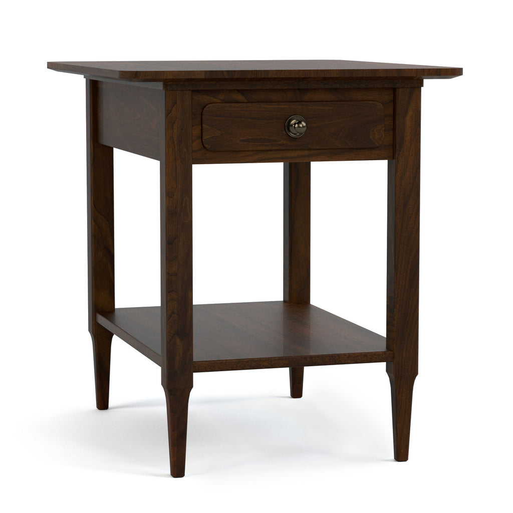 Wooden side table with a drawer on a white background