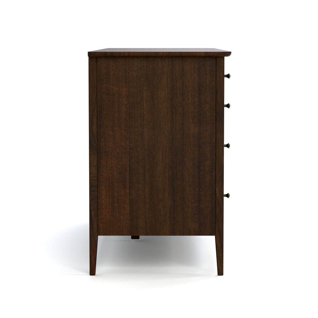 Wooden dresser with four drawers on a white background
