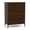Wooden dresser with four drawers on a white background