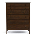 Wooden dresser with five drawers on a white background