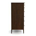 Wooden dresser with multiple drawers on a white background