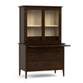 Wooden cabinet with glass doors and drawers on a white background