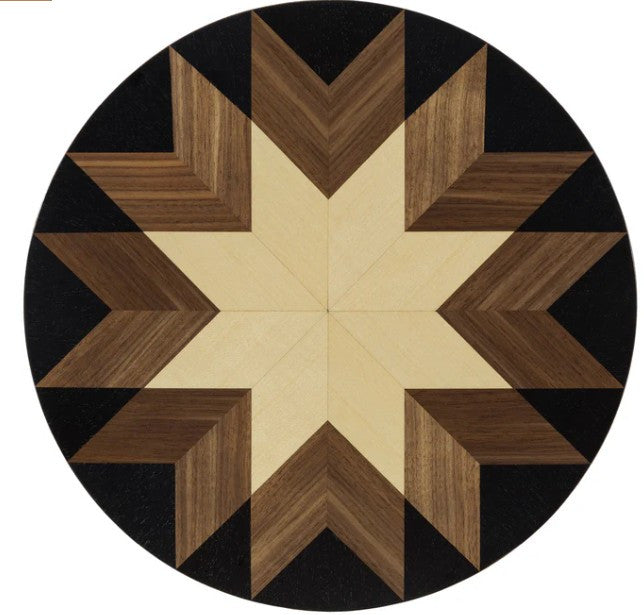 Round wooden table top with star pattern on a white background