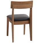 A modern wooden dining chair with a warm medium-brown wood frame and a black upholstered seat cushion, shown from a three-quarters angle on a white background.
