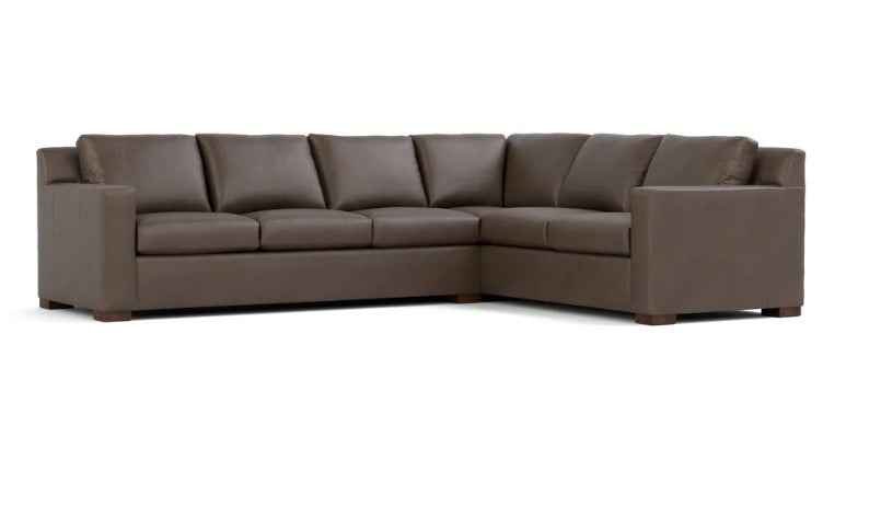 A modern L-shaped sectional sofa upholstered in dark brown leather, shown from a front three-quarter angle against a plain white background.