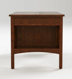 A dark brown wooden nightstand with a single drawer and an open shelf, photographed against a neutral light gray background.