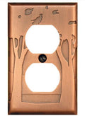 Copper wall plate with tree and bird design on a white background