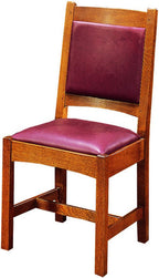 Wooden chair with purple cushioned seat and backrest on a white background