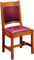 Wooden chair with purple cushioned seat and backrest on a white background