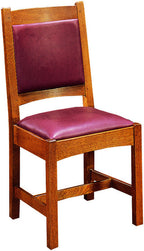 Wooden chair with purple cushioned seat and backrest on a white background