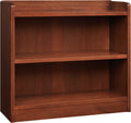Wooden bookshelf with three shelves on a white background