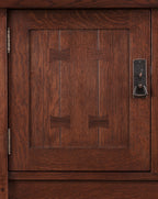 Close-up of a wooden cabinet door with a handle for the Stickley Mission Sideboard. 