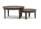Set of two round wooden coffee tables on a white background