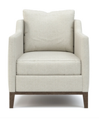 Beige armchair with wooden legs on a white background