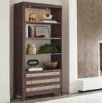 Wooden bookshelf with decorative items against a neutral wall.
