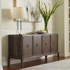 Wooden sideboard with decorative items in a room setting
