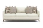 White sofa with patterned cushions on a white background