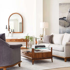 Modern living room with gray sofa, armchair, and wooden coffee table.
