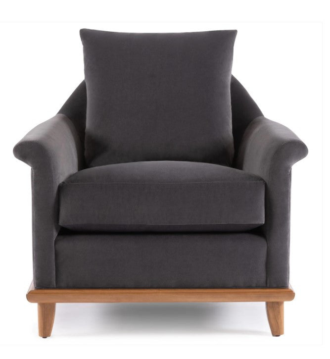 Gray armchair with a wooden base on a white background