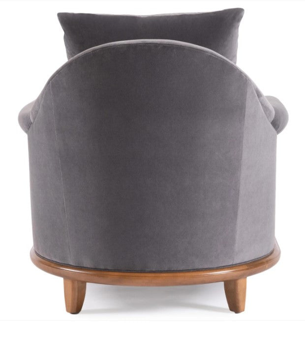 Gray velvet armchair with wooden legs on a white background