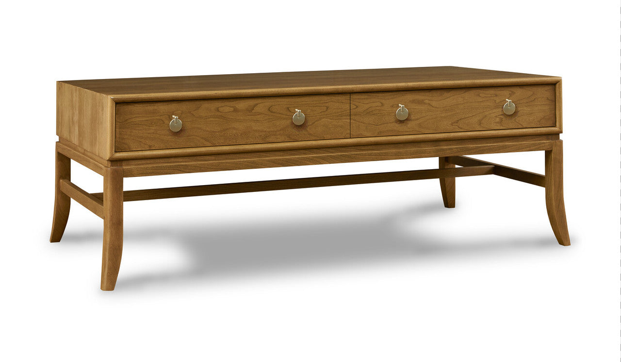 Wooden coffee table with three drawers on a white background