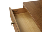 Wooden desk with open drawer, showing brand logo.