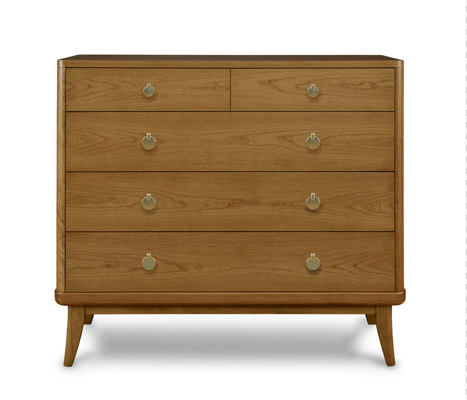 Wooden dresser with four drawers and brass knobs on a white background