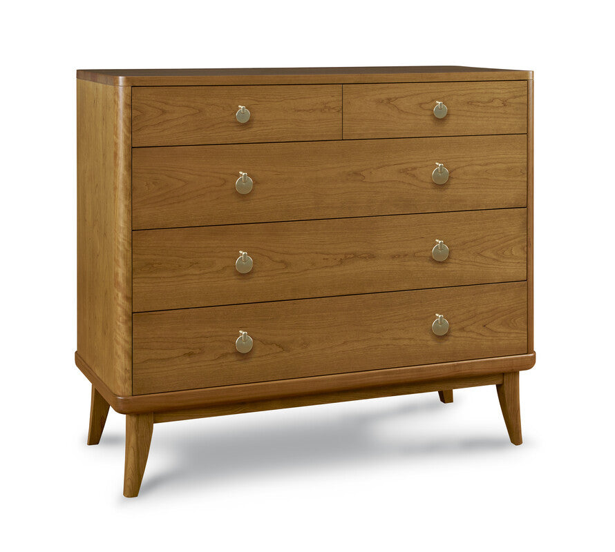 Wooden dresser with four drawers and metallic handles on a white background