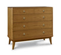 Wooden dresser with four drawers and metallic handles on a white background
