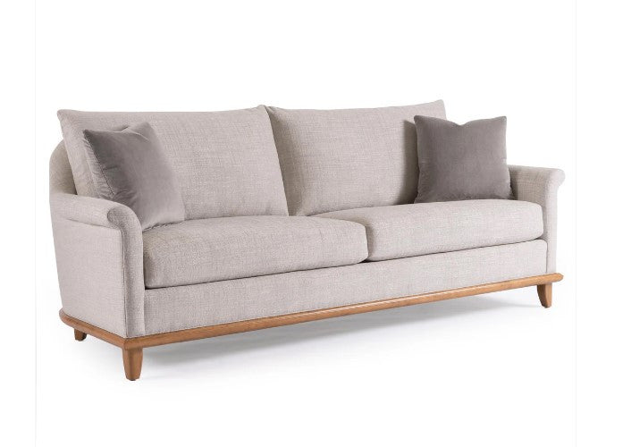 Gray sofa with wooden legs on a white background