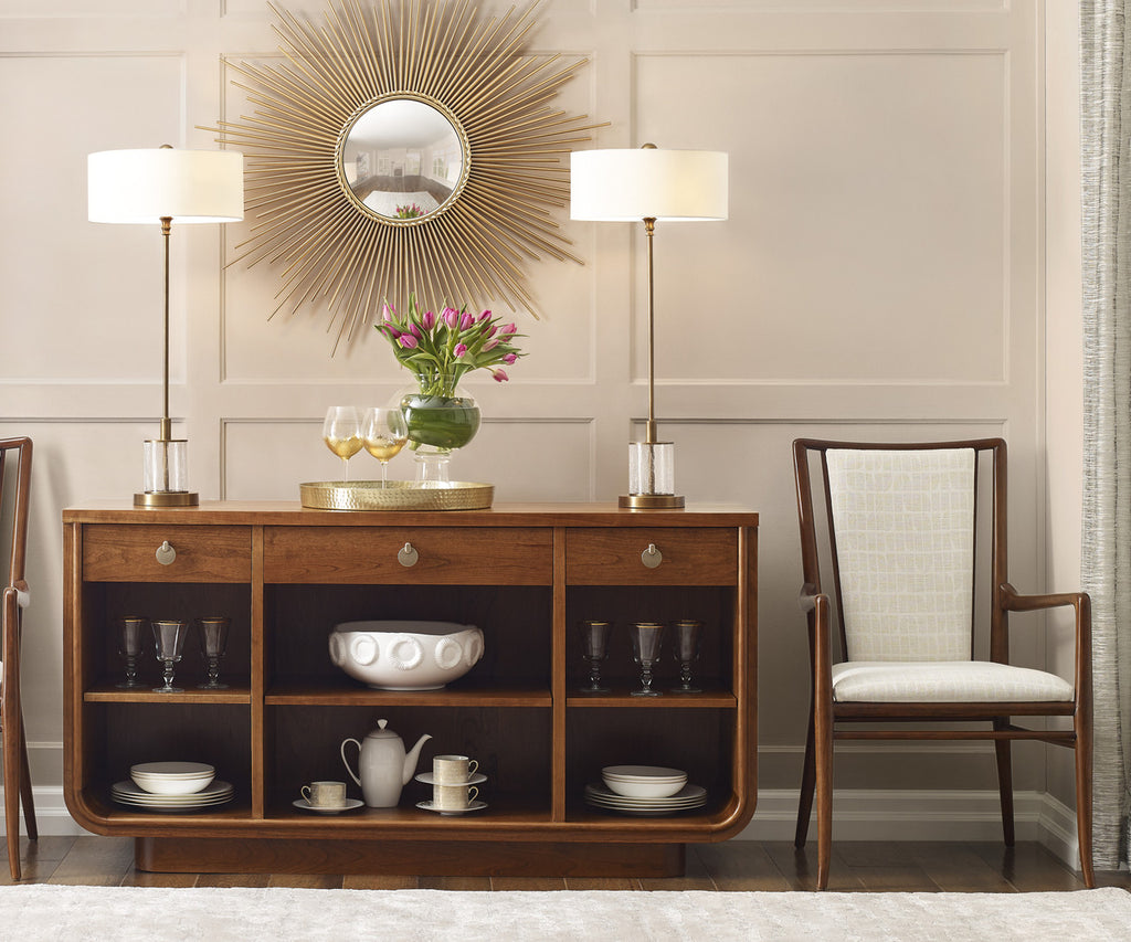 Wooden sideboard with decorative items in a living room setting.