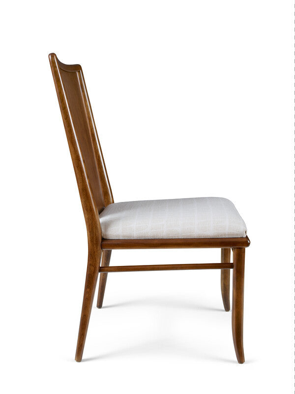 Wooden chair with a white cushion on a white background