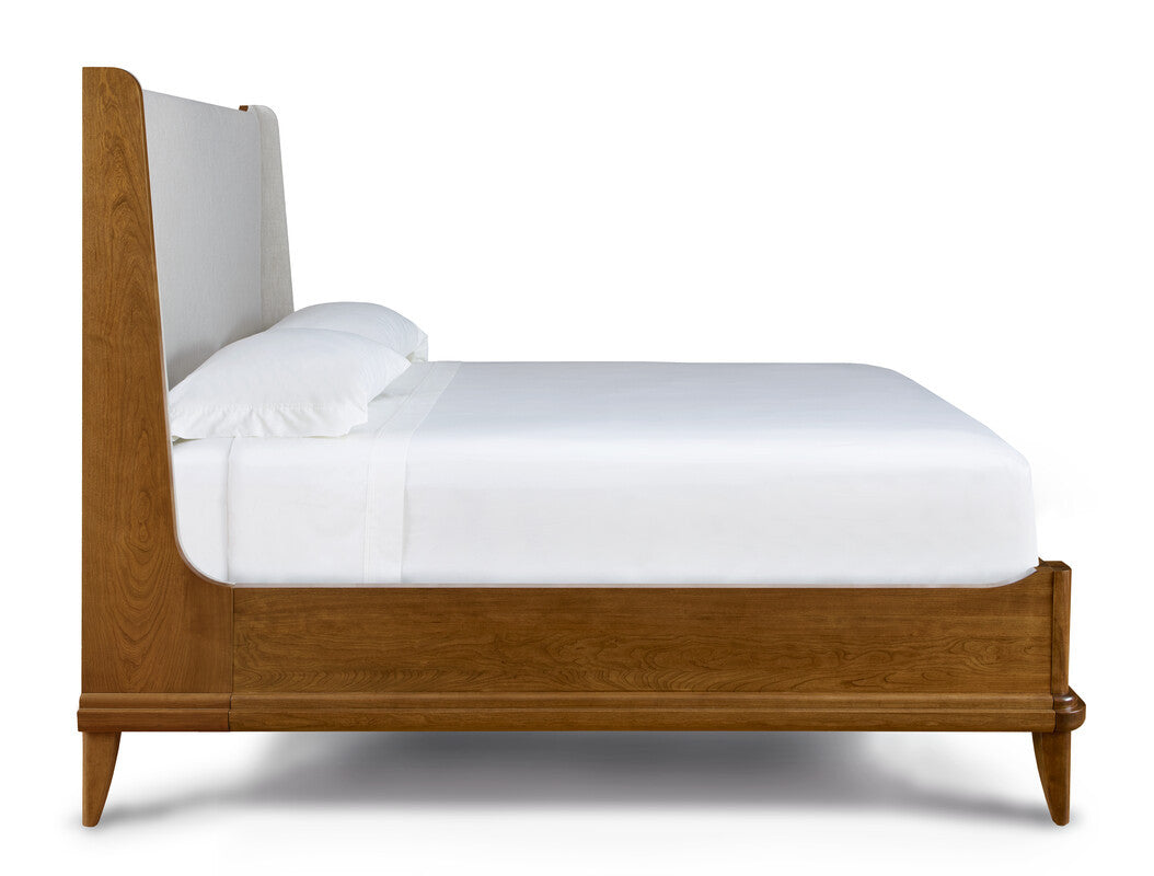 Wooden bed with white bedding on a white background