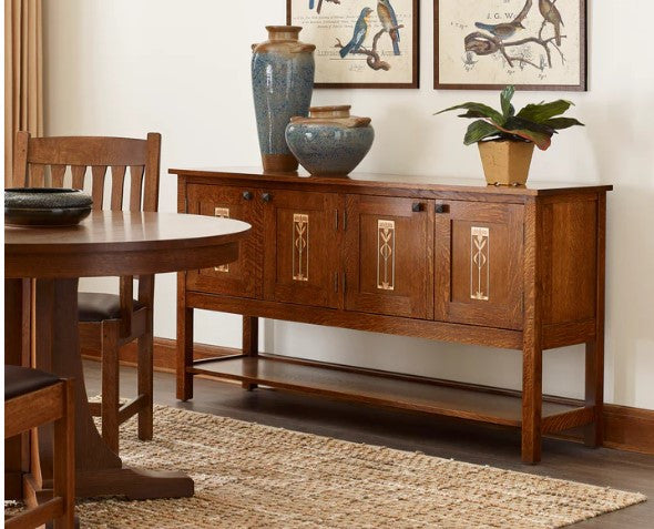 Wooden dining table and sideboard with decorative items in a room setting.