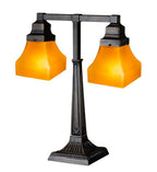 Double lamp with orange glass shades on a white background