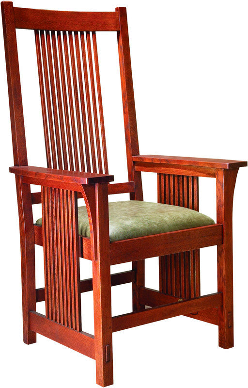 Wooden chair with a green cushion on a white background