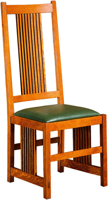Wooden chair with a green cushion on a white background