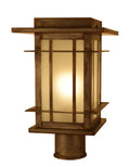 Bronze outdoor lamp with glass shade on a white background