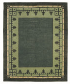 Green and beige area rug with geometric border design