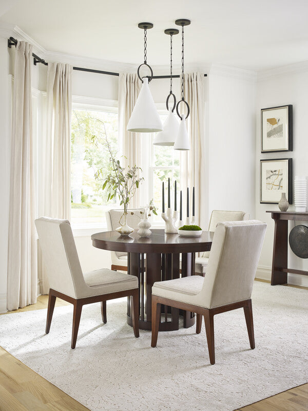 Wooden round table with a dark brown finish.
