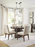 Wooden round table with a dark brown finish.
