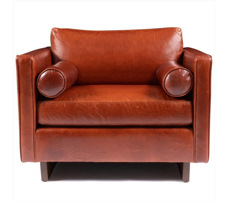 Brown leather armchair on a white background