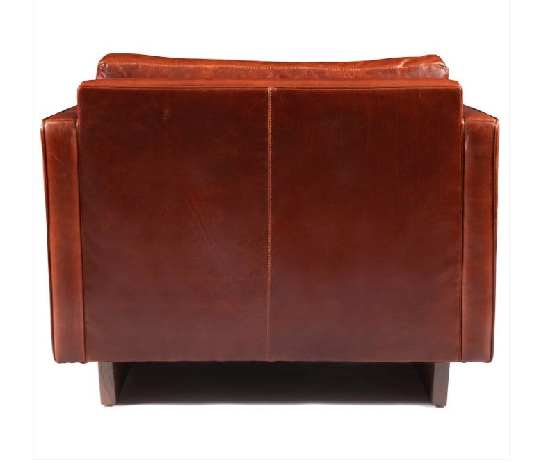 Brown leather armchair on a white background