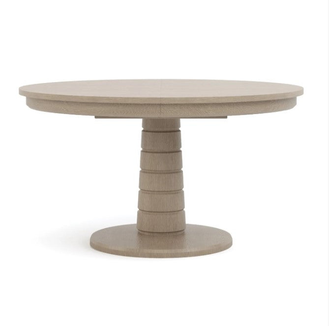 Round wooden table with a textured surface on a white background